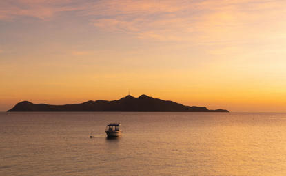 Manamoc Island at sunset, Amanpulo resort, Philippines.