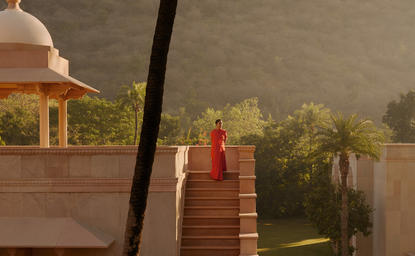 Amanbagh's main building exterior with Amansanti spa pavilion visible through morning mist.