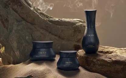 Dark ceramic vessels displayed with natural wood and stone at Amanjiwo.