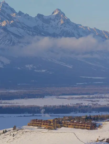 Amangani overlooks the snow-covered valley and mountain peaks of Jackson Hole, Wyoming.