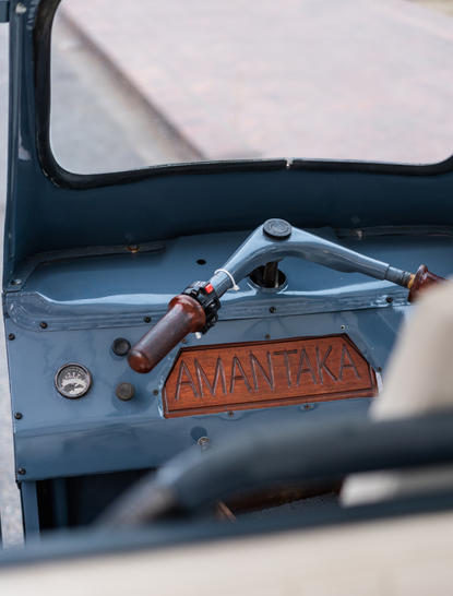 Vintage car interior detail showing steering wheel and leather trim at Amantaka, Laos.