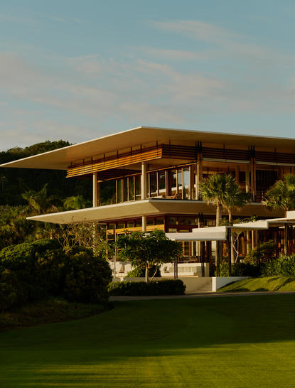 Amanera resort exterior with contemporary wooden architecture and manicured gardens, Dominican Republic.