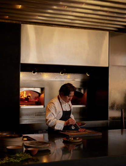Chef preparing a dish at Amangiri resort's dining venue.