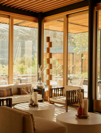 Camp Sarika restaurant at Amangiri with floor-to-ceiling windows overlooking desert landscape.