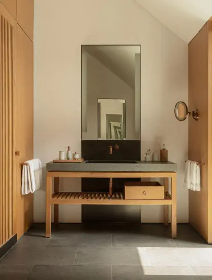 Ming Pavilion accommodation vanity at Amanyangyun Shanghai with wooden cabinetry and mirror.