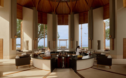 Bar at Amanyara resort with octagonal pavilion, natural light, and ocean views.