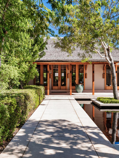 Five-bedroom beach sala villa at Amanyara, Turks and Caicos, with wooden pavilion and manicured landscaping.