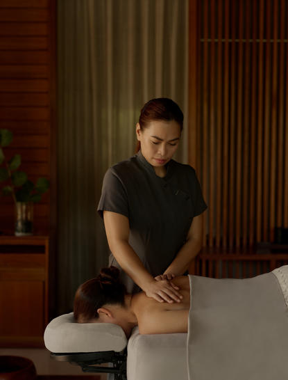 Therapist administering a wellness treatment at Amanyara resort in Turks and Caicos.