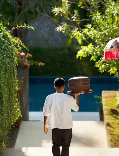 Private butler attending to guest at Aman Villas at Nusa Dua, Indonesia.