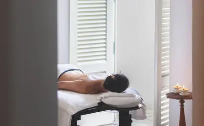 Woman resting on massage table at Amangalla, Sri Lanka