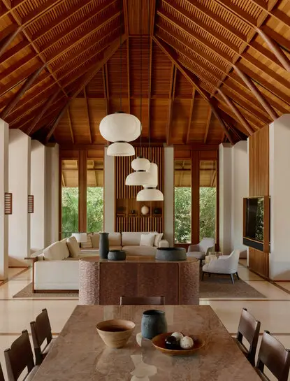Villa interior with soaring timber ceiling and pendant lights at Amanyara resort, Turks and Caicos.