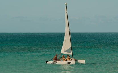 Hobie Cat sailing catamaran on turquoise waters at Amanyara, Turks and Caicos.