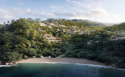 安缦丘澜度假村外观，建筑依山傍海而建，被茂密的热带植被所环绕。
