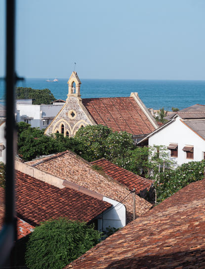 Terracotta rooflines and a whitewashed church overlook the Indian Ocean at Amangalla.