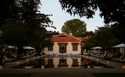 Pool terrace at Amantaka during Krathong celebrations, Laos.