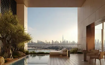 External terrace at Aman Dubai with plunge pool overlooking the city skyline at dusk.