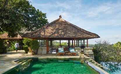 Amandari's open-sided pavilion with thatched roof overlooks an emerald plunge pool and verdant gardens.