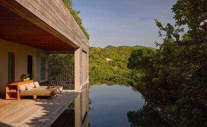 Forest wellness pool villa at Amanoi, Vietnam, overlooking tranquil waters and lush vegetation.