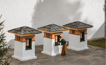 Amankora pavilions with wooden roofs and white walls in Thimphu, Bhutan.