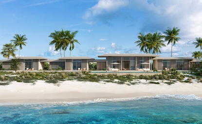 Amancaya villa exterior with whitewashed architecture facing a pristine beach and turquoise waters.