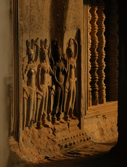 Carved wooden relief depicting Apsara dancers at Amansara, Cambodia.