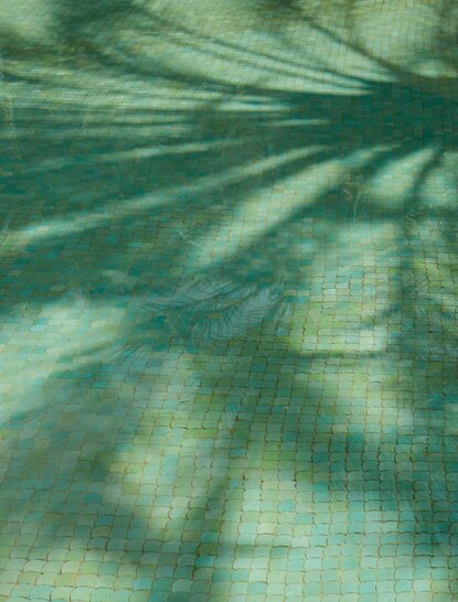 Pool detail at Amanjena resort, Morocco, showing water and tile patterns.