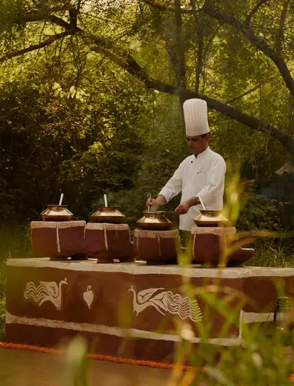 Chef preparing a private dining experience outdoors at Aman-i-Khas, India.