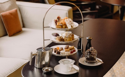 Afternoon tea service at Aman Venice with tiered stand of pastries and refreshments.