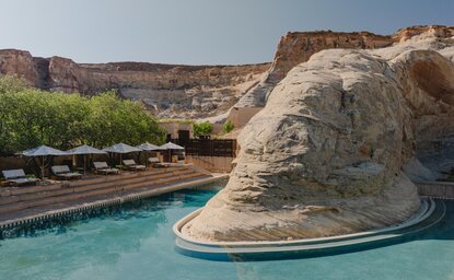 Amangiri's plunge pool nestled against desert rock formations in Utah.