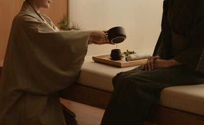 Therapist administering a wellness treatment at Aman Tokyo's spa facility.