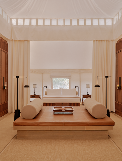 Tented pool pavilion at Aman-i-Khas in India with sunken soaking tub and candlelit ambiance.