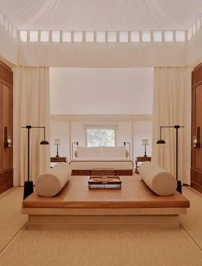 Tented pool pavilion at Aman-i-Khas in India with sunken soaking tub and candlelit ambiance.
