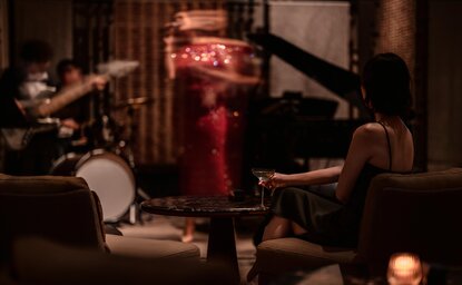Band performing in the Aman Lounge at Aman Nai Lert Bangkok, Thailand, viewed from the stage.
