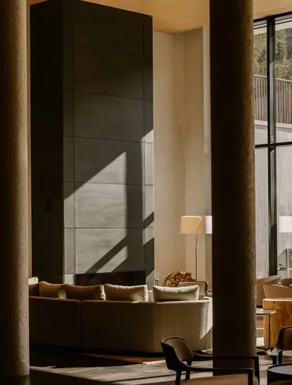 Winter garden at Aman Rosa Alpina with dark architectural feature and warm lighting.