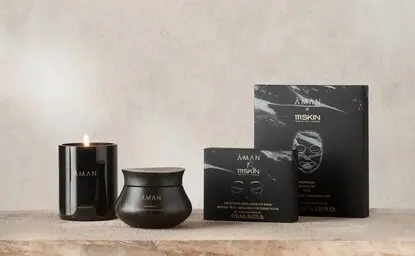 Aman Essentials Holiday Skin Nourishing Pathway Gift Set with black packaging and containers.
