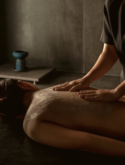 Hammam treatment at Amanoi resort, person receiving traditional steam bath wellness experience.