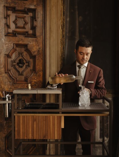 Bar Manager Antonio Ferrara crafting a cocktail at Aman Venice, Italy.
