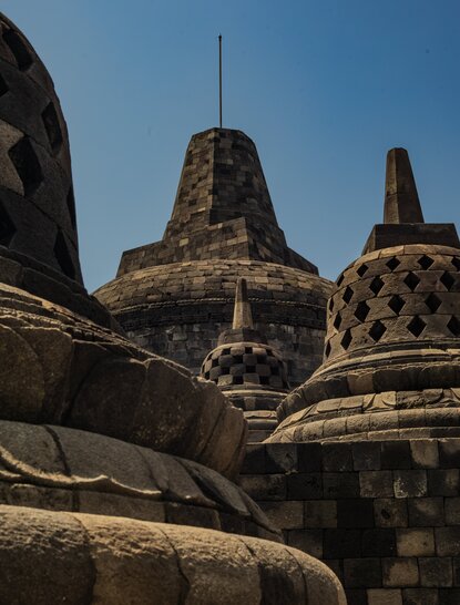 Stone stupas of Borobudur temple viewed from Amanjiwo, Indonesia.
