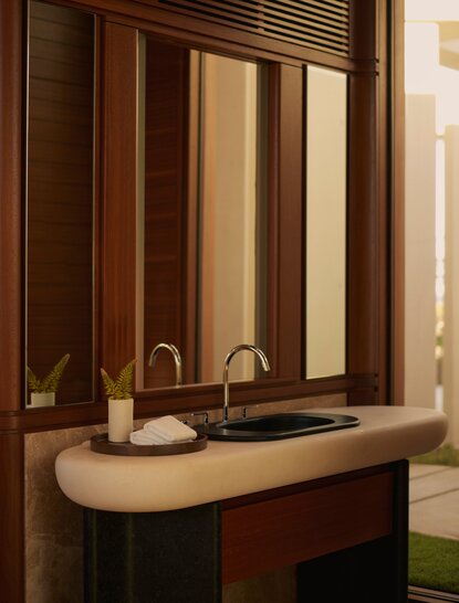Estuary Casita bathroom with wooden vanity and mirror at Amanvari, Mexico.