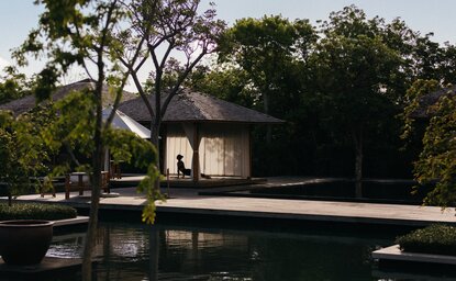 Spa pavilion reflected in still water at Amanyara, Turks and Caicos.