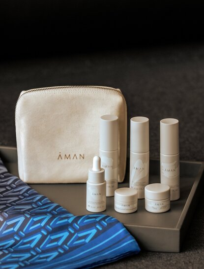 Aman Essentials gift box with skincare products and canvas pouch at Aman Nai Lert Bangkok.