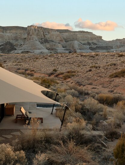 Camp Sarika exterior at Amangiri with desert landscape and sandy terrain.