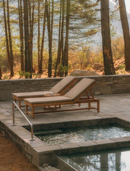 Spa house platform overlooking a forest stream at Amankora's Paro Lodge.