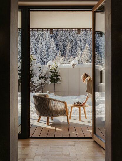 Zen garden room at Aman Rosa Alpina resort with soaking tub and forest view.