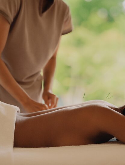 Therapist performing acupuncture treatment at Amanemu spa and wellness centre, Japan.
