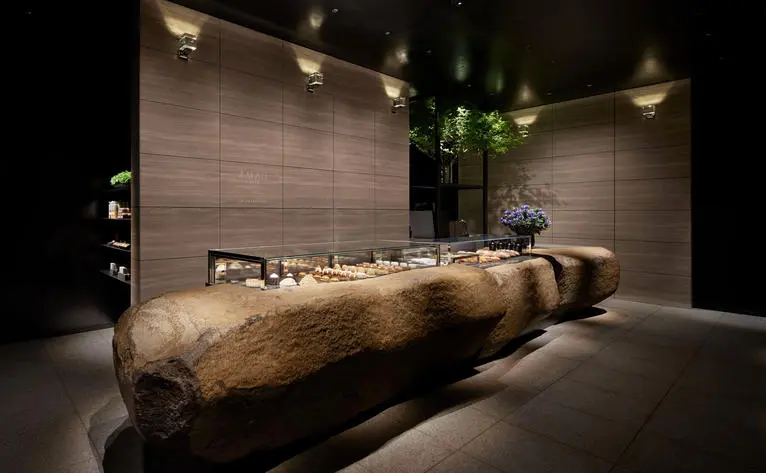 Patisserie display counter with wooden counter top at Aman Tokyo hotel.