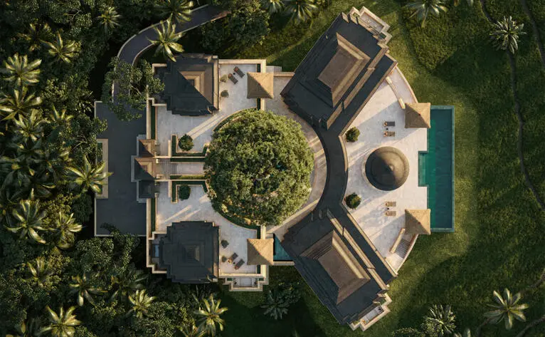 Aerial view of Amanjiwo resort residences nestled amongst lush tropical vegetation in Indonesia.