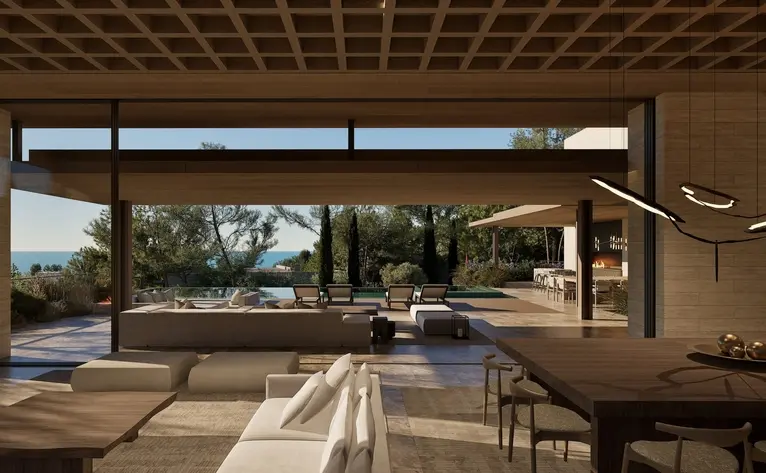 Amanruya interior with open-plan living space overlooking terraced gardens through floor-to-ceiling windows.