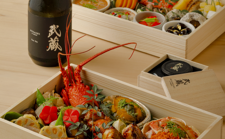 Osechi bento boxes with traditional Japanese New Year dishes at Aman Tokyo hotel.