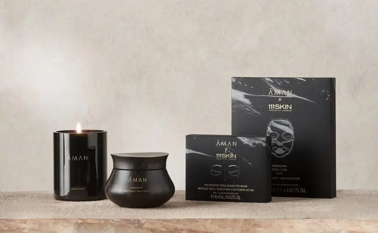 Aman Essentials Holiday Skin Nourishing Pathway Gift Set with black packaging and containers.